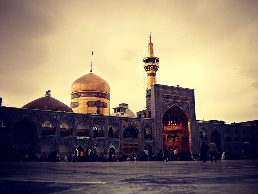 Imam Reza Shrine in Mashhad with Golden Dome and Minaret at Dusk HD wallpaper