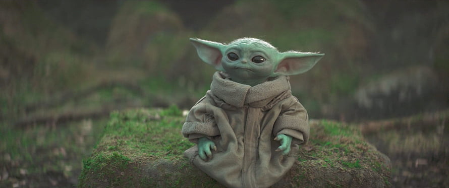 Baby Yoda from The Mandalorian sitting on a mossy rock in a forest, Grogu in 'The Mandalorian', grogu baby yoda HD wallpaper