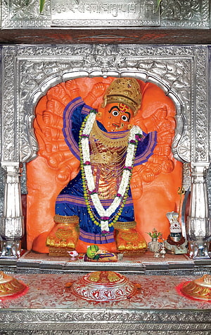 Vibrant Statue of Ayyappa God in Blue Robes with Silver Temple Shrine HD phone wallpaper