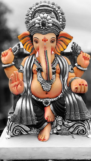Ornate Silver Ganesha Statue with Colorful Accents and Intricate Jewelry Details HD phone wallpaper