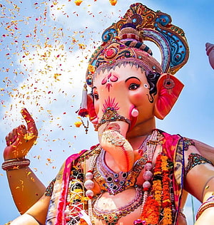 Ganesha Festival Portrait With Flower Petals And Ornate Jewelry HD phone wallpaper