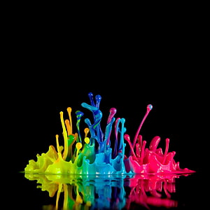 Vibrant Multicolor Paint Splash on Black Background with Reflection HD phone wallpaper