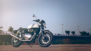 Royal Enfield Continental GT 650 Classic Motorcycle Parked on Open Road at Dusk HD wallpaper