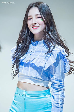 Nancy from Momoland in a blue ruffled crop top and turquoise skirt HD phone wallpaper