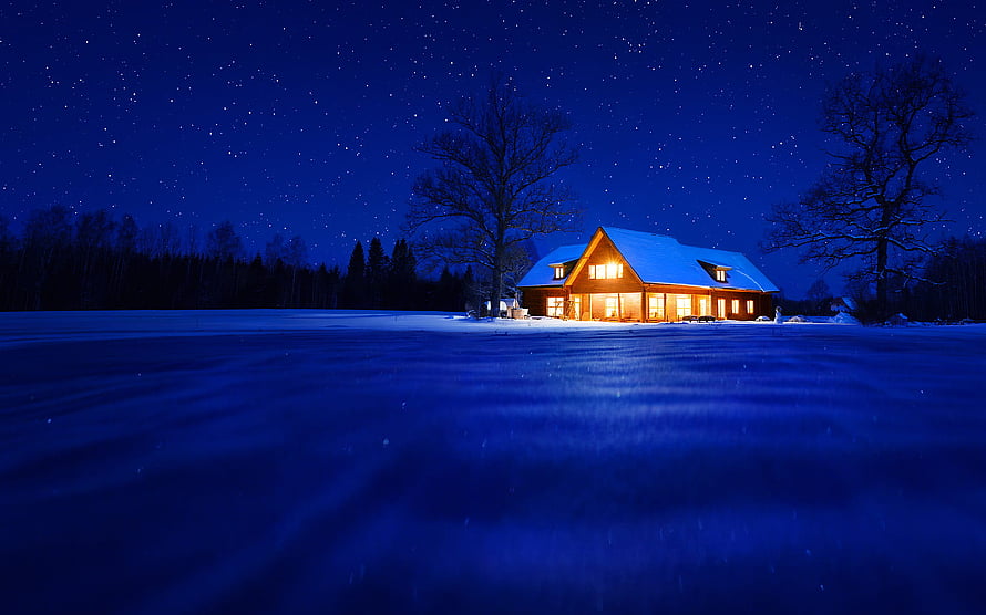 Cozy Snow-Covered Cabin Under a Starry Winter Night Sky HD wallpaper