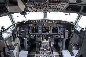 Boeing 737 Cockpit Interior with Digital Flight Instruments and Control Yokes HD wallpaper