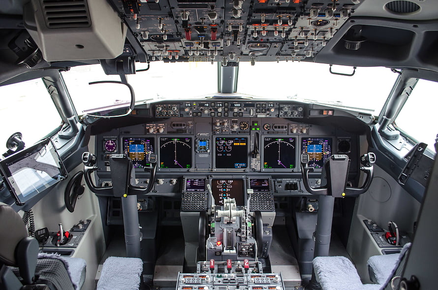 Boeing 737 Cockpit Interior with Digital Flight Instruments and Control Yokes HD wallpaper