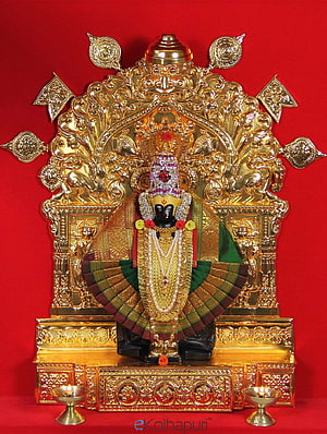 Ornate Mahalaxmi Deity Idol with Gold Filigree Backdrop and Brass Oil Lamps on Red Background HD phone wallpaper