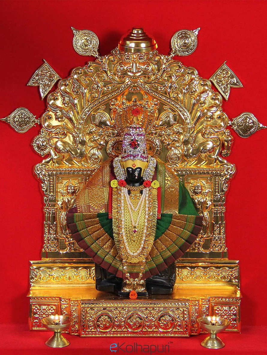 Ornate Mahalaxmi Deity Idol with Gold Filigree Backdrop and Brass Oil Lamps on Red Background HD phone wallpaper