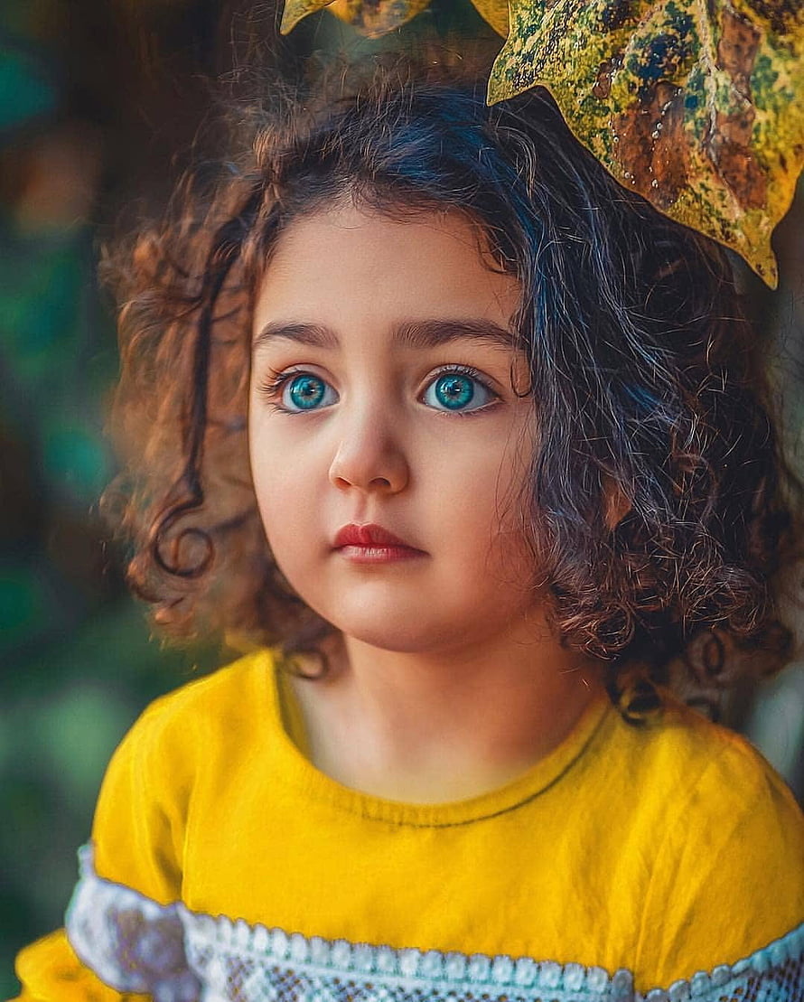 Portrait of a Toddler Girl with Blue Eyes and Curly Hair Wearing a Yellow Dress HD phone wallpaper