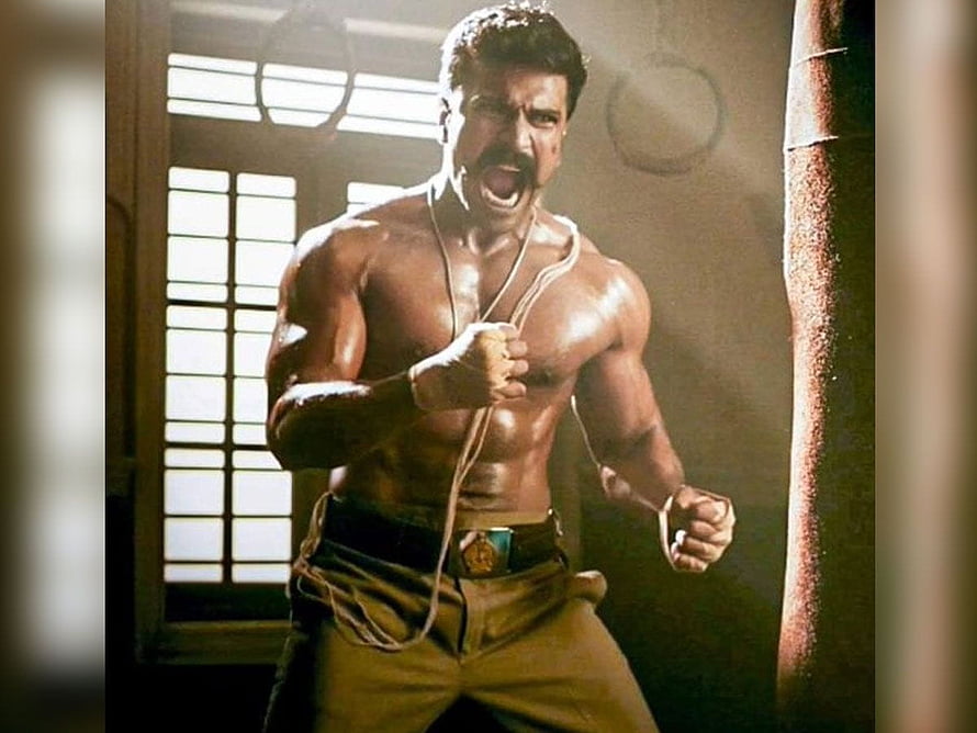 Ram Charan as Bheem in RRR shirtless action scene with intense expression HD wallpaper