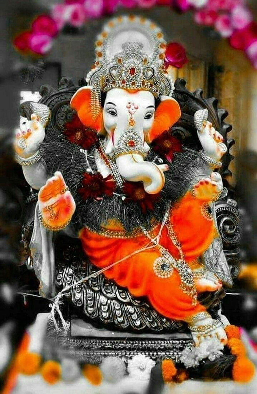 Ornate Ganesha Murti Adorned With Jewels And Marigold Garland HD phone wallpaper