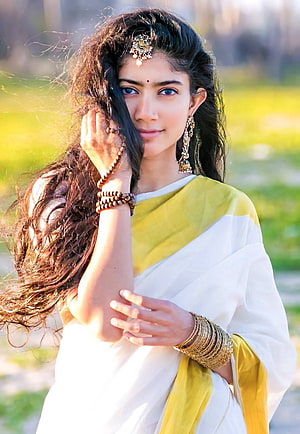 Portrait of a woman in a white and yellow saree with traditional jewelry and henna, Sai pallavi by invisiblesmilesss, sai pallavi saree HD phone wallpaper