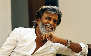 Rajinikanth smiling portrait in white shirt with silver beard and wristwatch HD wallpaper