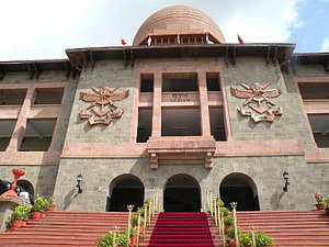 Sudan Naval Headquarters Building in Mumbai with Red Carpet and Emblem HD wallpaper
