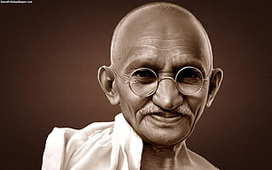 Mahatma Gandhi Portrait in Sepia Tone with Round Glasses and White Dhoti HD wallpaper