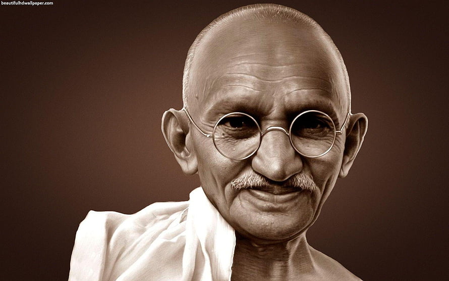Mahatma Gandhi Portrait in Sepia Tone with Round Glasses and White Dhoti HD wallpaper