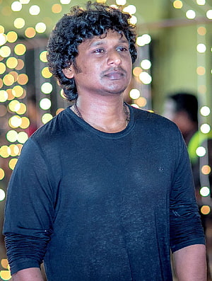 Lokesh Kanagaraj Portrait in Black Shirt with Festive Bokeh Lights HD phone wallpaper