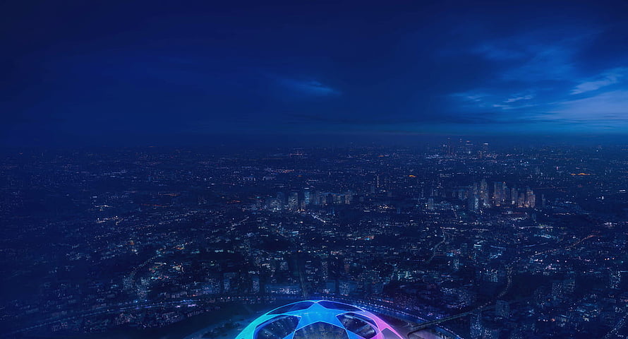 UEFA Champions League Ball Floating Over a Glowing City at Night HD wallpaper