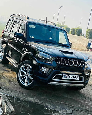 Black Mahindra Scorpio SUV with Custom Alloy Wheels and Chrome Grille HD phone wallpaper