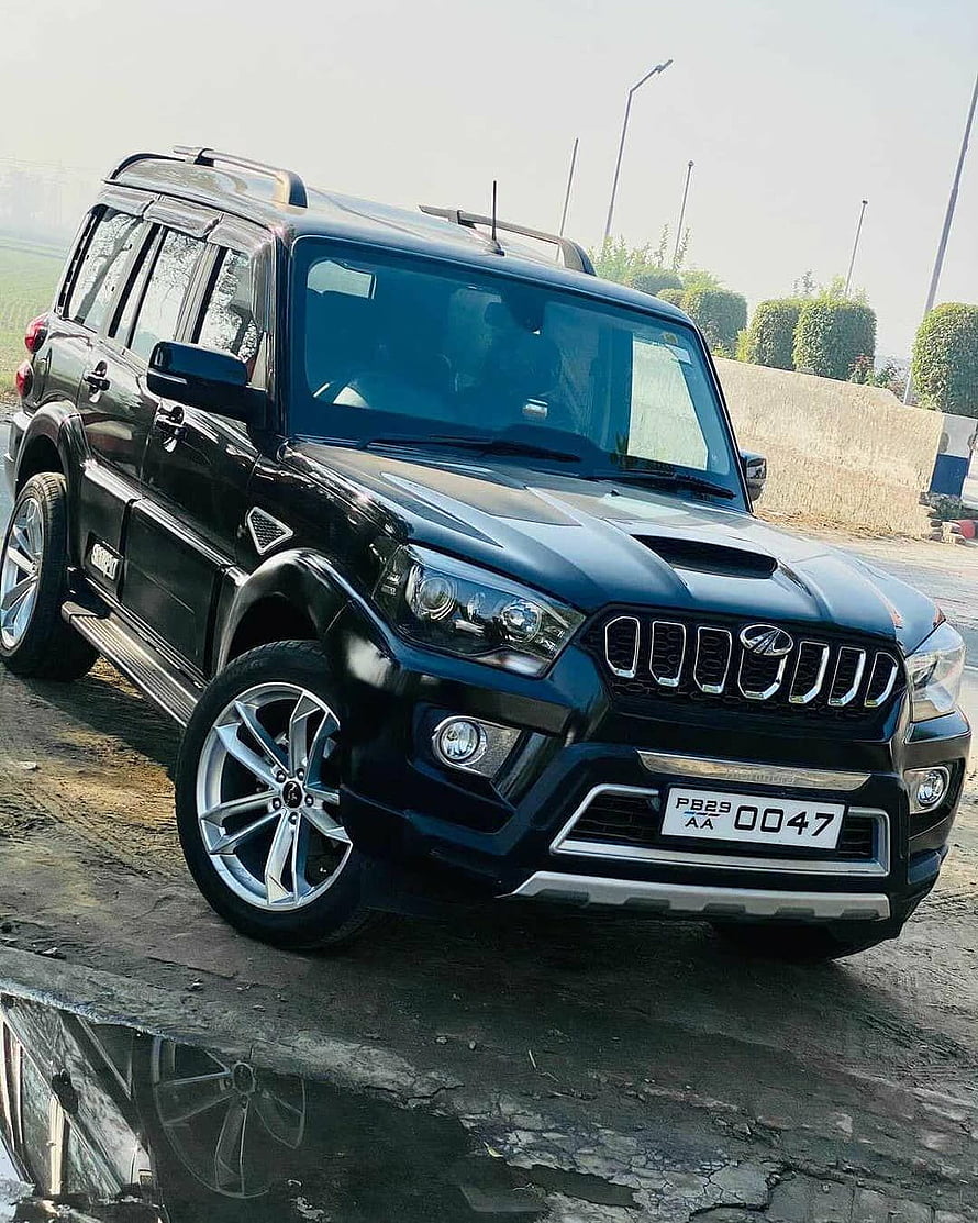Black Mahindra Scorpio SUV with Custom Alloy Wheels and Chrome Grille HD phone wallpaper