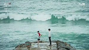 Goblin Korean Drama Scene: Two Characters on a Rocky Pier Facing the Ocean HD wallpaper