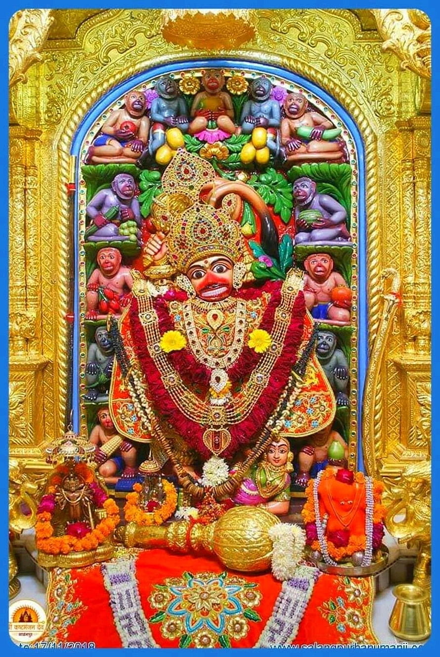 Ornate Hanumanji Temple Idol with Marigold Garlands and Golden Decorations HD phone wallpaper
