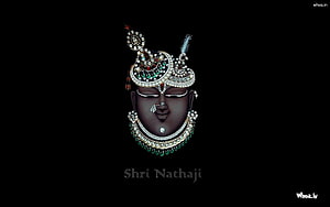 Shrinathji Devotional Portrait with Ornate Crown and Jewelry on Black Background HD wallpaper