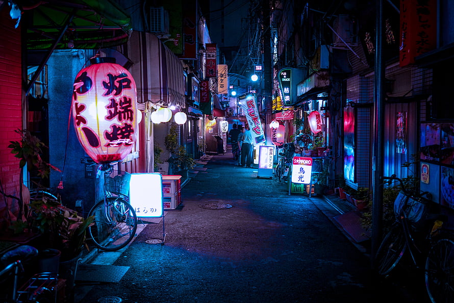 Neon-lit Japanese alleyway at night with glowing lanterns and vintage bicycles HD wallpaper