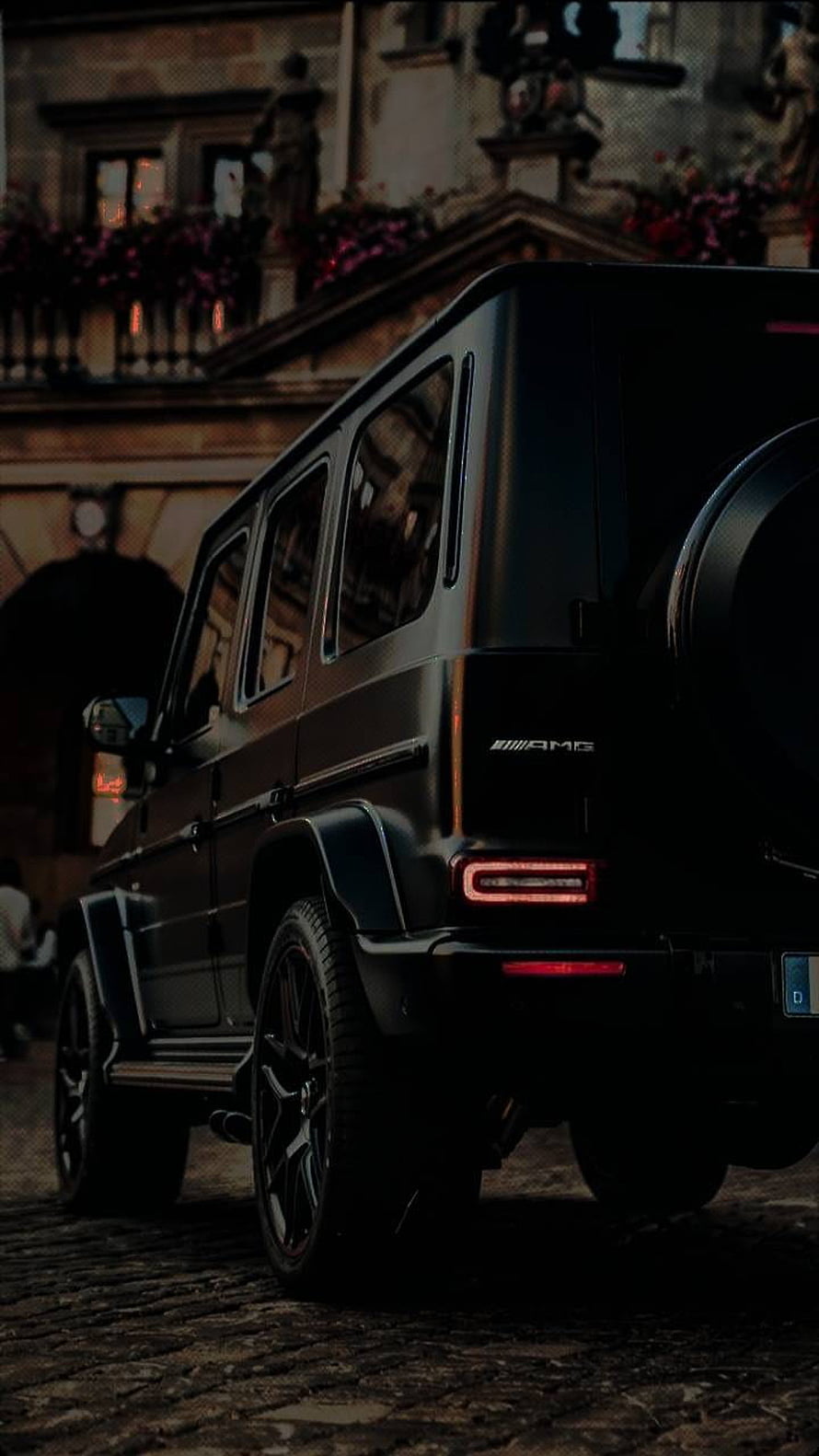 Matte Black Mercedes-AMG G-Class SUV Parked on Cobblestone Street at Night HD phone wallpaper