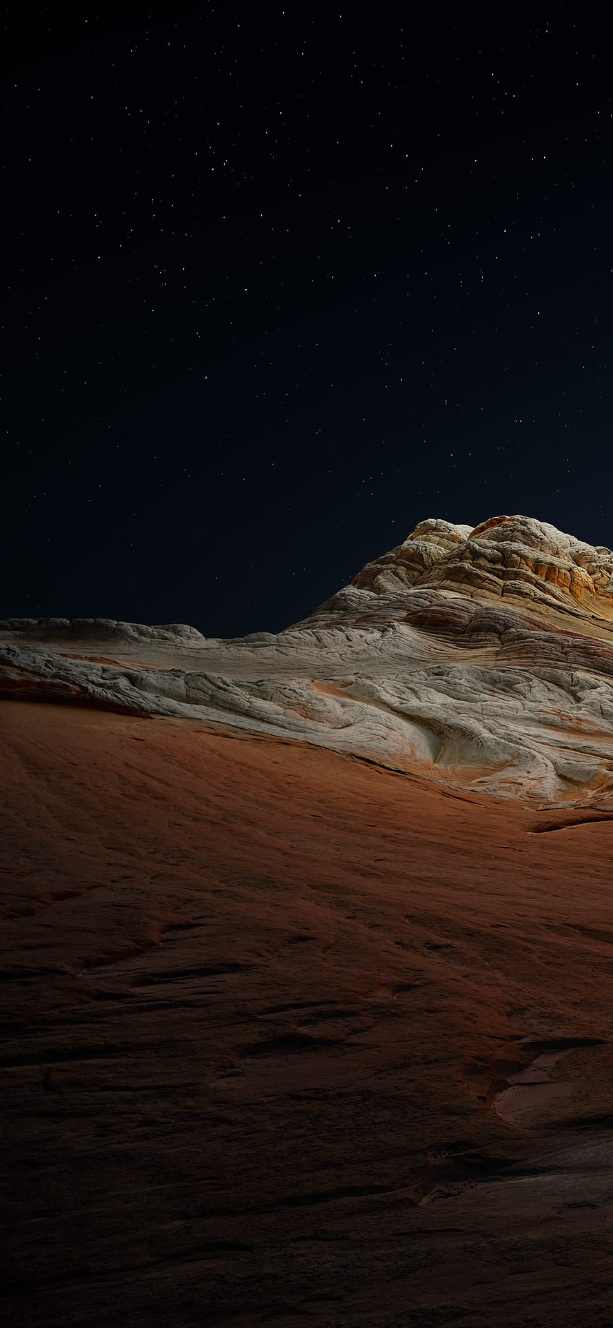 Starry Night Sky Over Layered Desert Rock Formations and Red Sand Dunes HD phone wallpaper