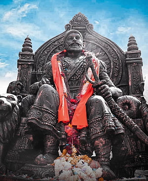 Majestic Statue of Chhatrapati Shivaji Maharaj Seated on Ornate Throne with Sword HD phone wallpaper