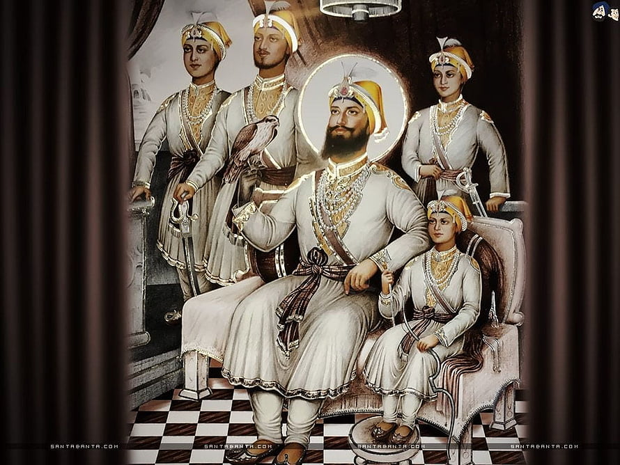 Guru Gobind Singh and the Four Sahibzaade in Traditional Sikh Attire HD wallpaper