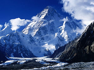 Majestic K2 Summit Rising Above Glacial Valleys Under a Deep Blue Sky HD wallpaper