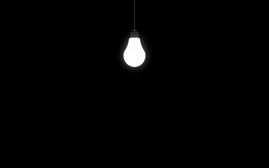 Glowing Light Bulb Hanging in Dark Minimalist Black Background HD wallpaper