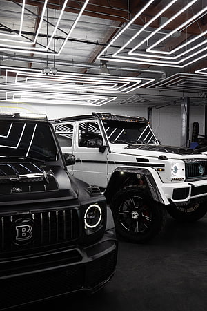 Brabus Modified Mercedes G-Class SUVs in Modern Garage with Neon Lights HD phone wallpaper