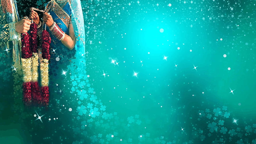 Indian Wedding Couple Holding Floral Garland Against Teal Sparkling Background HD wallpaper