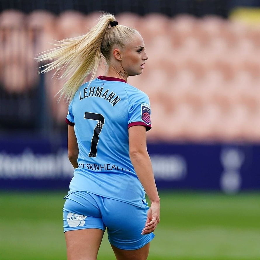 Alisha Lehmann in light blue football kit with number seven on the pitch HD phone wallpaper