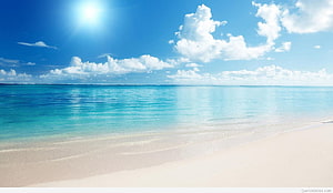 Serene Tropical Beach with Turquoise Water and White Sand Under a Bright Blue Sky HD wallpaper