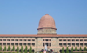 National Defence Academy Building with Central Dome and Military Emblems HD wallpaper