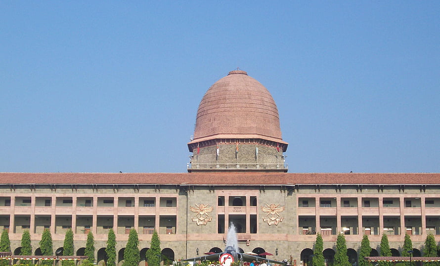 National Defence Academy Building with Central Dome and Military Emblems HD wallpaper