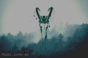 Loki Sigil Over Misty Pine Forest with Dark Ink Splatter and Teal Glow HD wallpaper