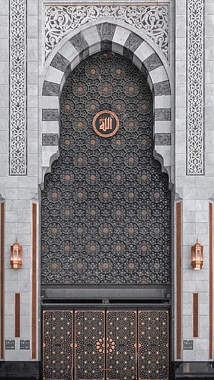 Ornate Islamic Mosque Gate with Intricate Geometric Metalwork and Arabic Calligraphy HD phone wallpaper