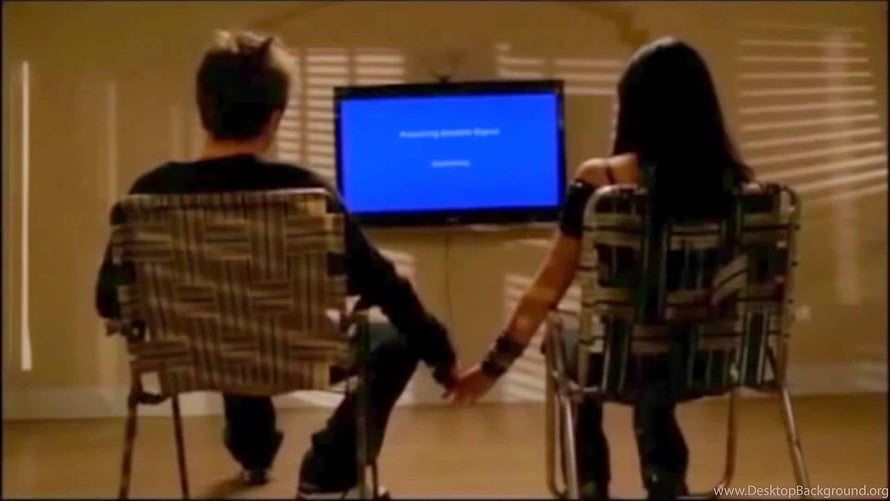 Couple Holding Hands Watching TV Screen With Blue Error Message In Living Room HD wallpaper
