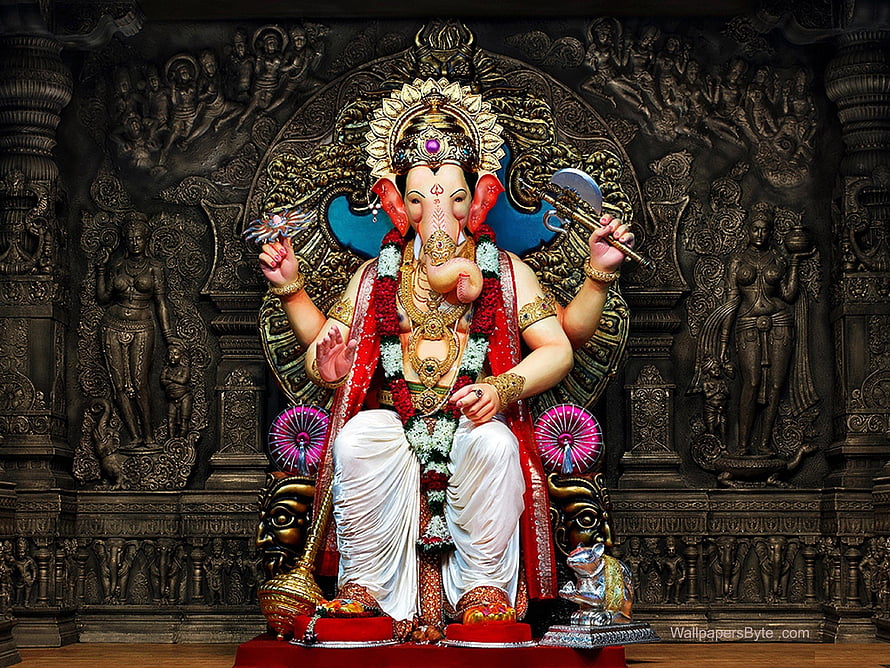 Lord Ganesha Statue with Axe and Lotus in Ornate Temple Setting HD wallpaper