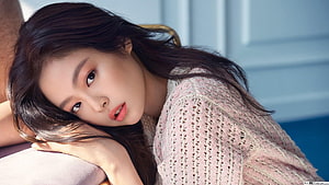 Jennie Kim from Blackpink in a soft pink knit sweater with long dark hair HD wallpaper
