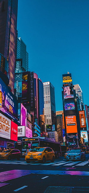 Vibrant Times Square New York City Street Scene with Yellow Taxis and Neon Billboards HD phone wallpaper