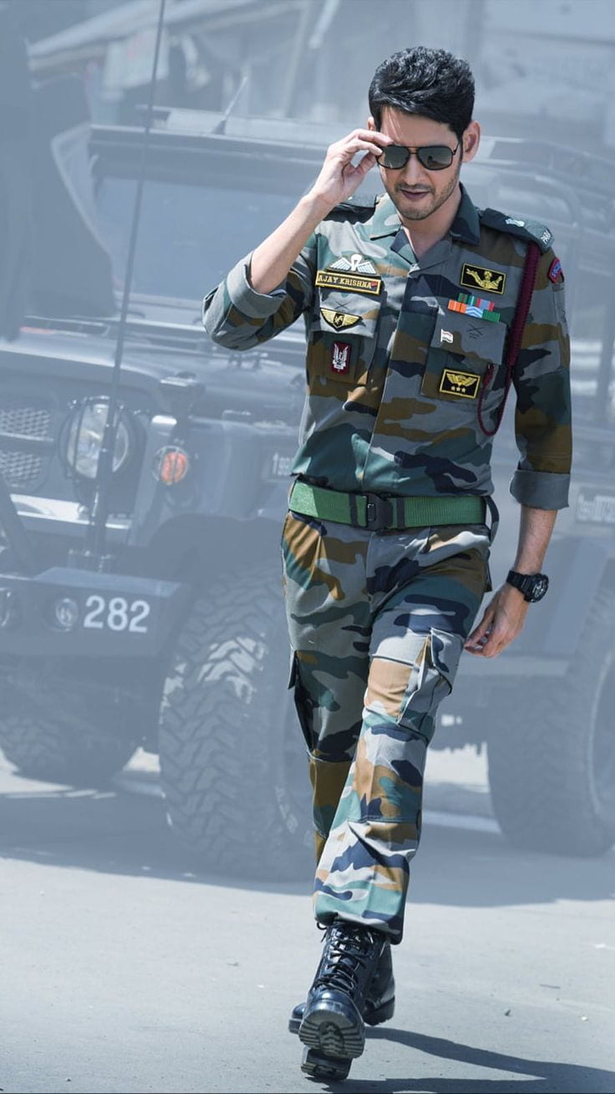 Indian Army Officer in Camouflage Uniform Walking Past Military Vehicle HD phone wallpaper