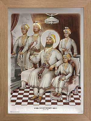 Guru Gobind Singh and the Chaar Sahibzaade in Traditional Mughal Attire HD phone wallpaper