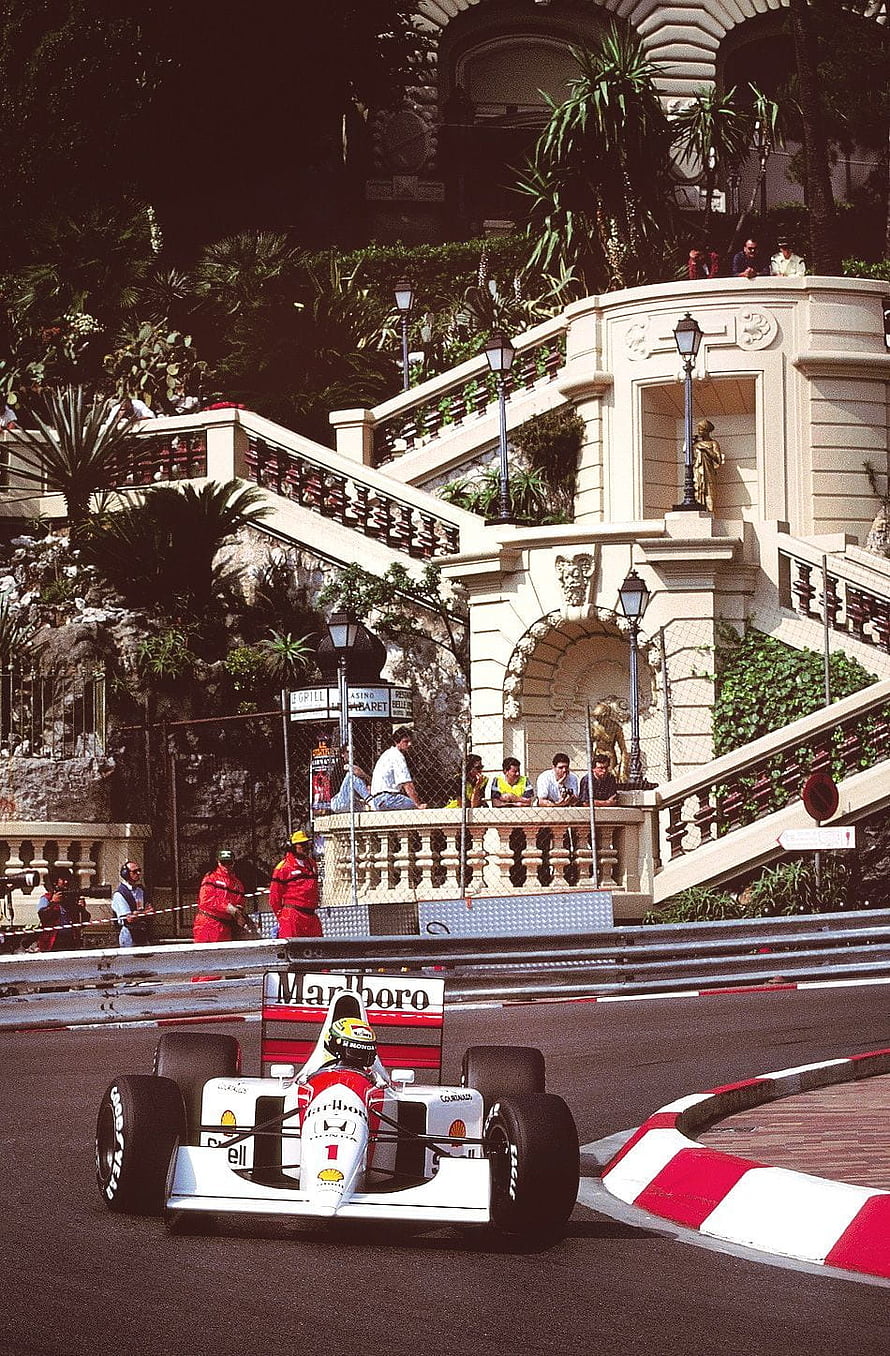 Michael Schumacher driving a McLaren MP4/13 Formula 1 car at the Monaco Grand Prix HD phone wallpaper